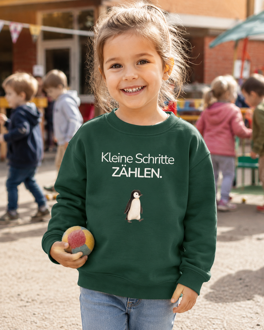 Kinder Premium Sweatshirt Pinguin „Kleine Schritte zählen.“